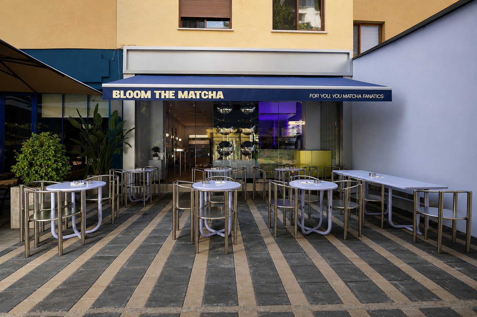 Facade and terrace of Bloom the Matcha with stainless steel outdoor seating