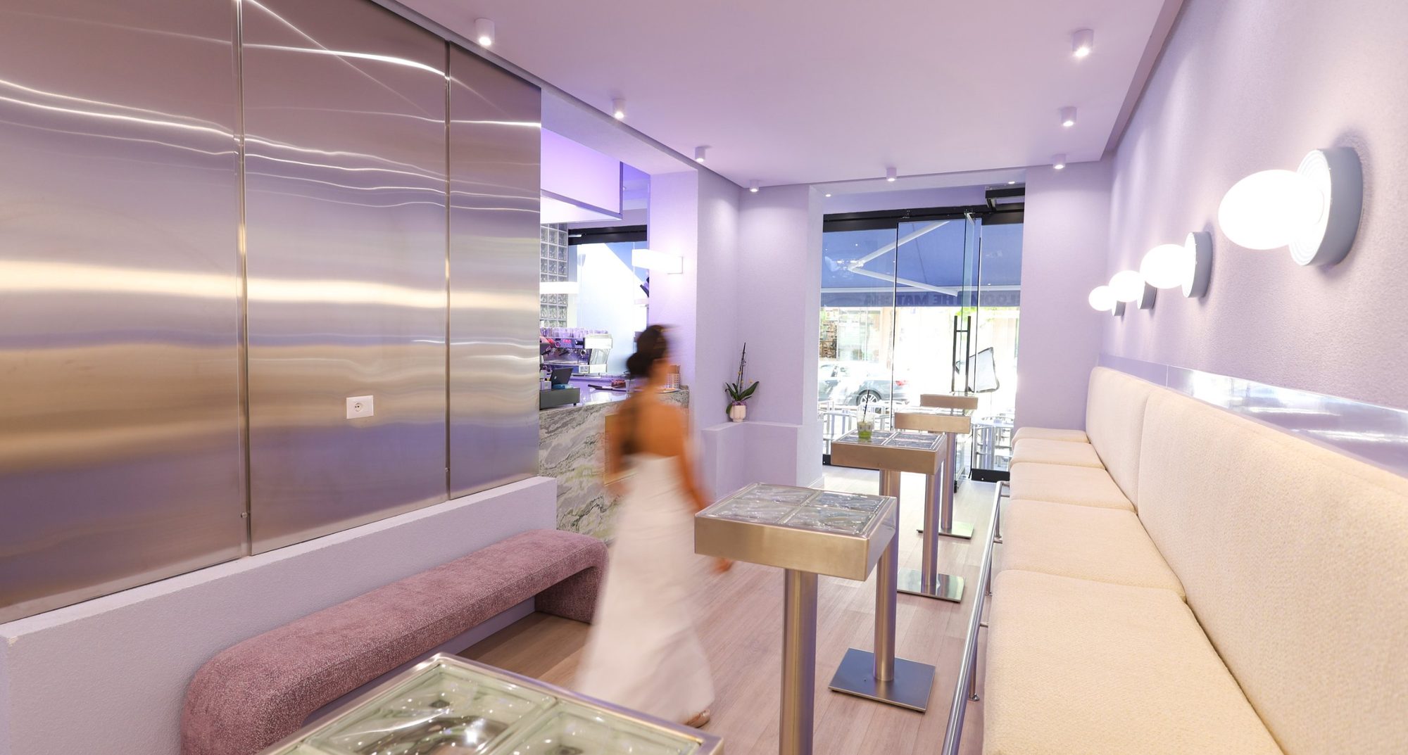 Stainless steel high tables with textured glass-block tops at Bloom the Matcha