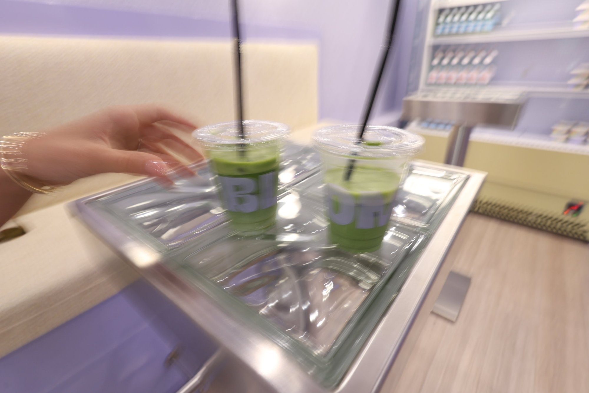 Matcha prepared at a stainless steel high table, Bloom the Matcha, Tirana