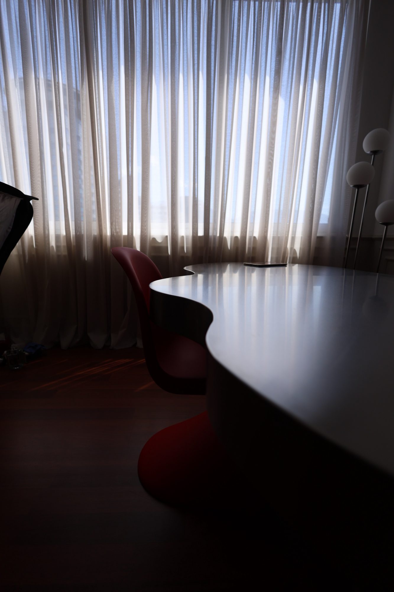 The stainless steel table photographed at dusk in the Door 903 studio