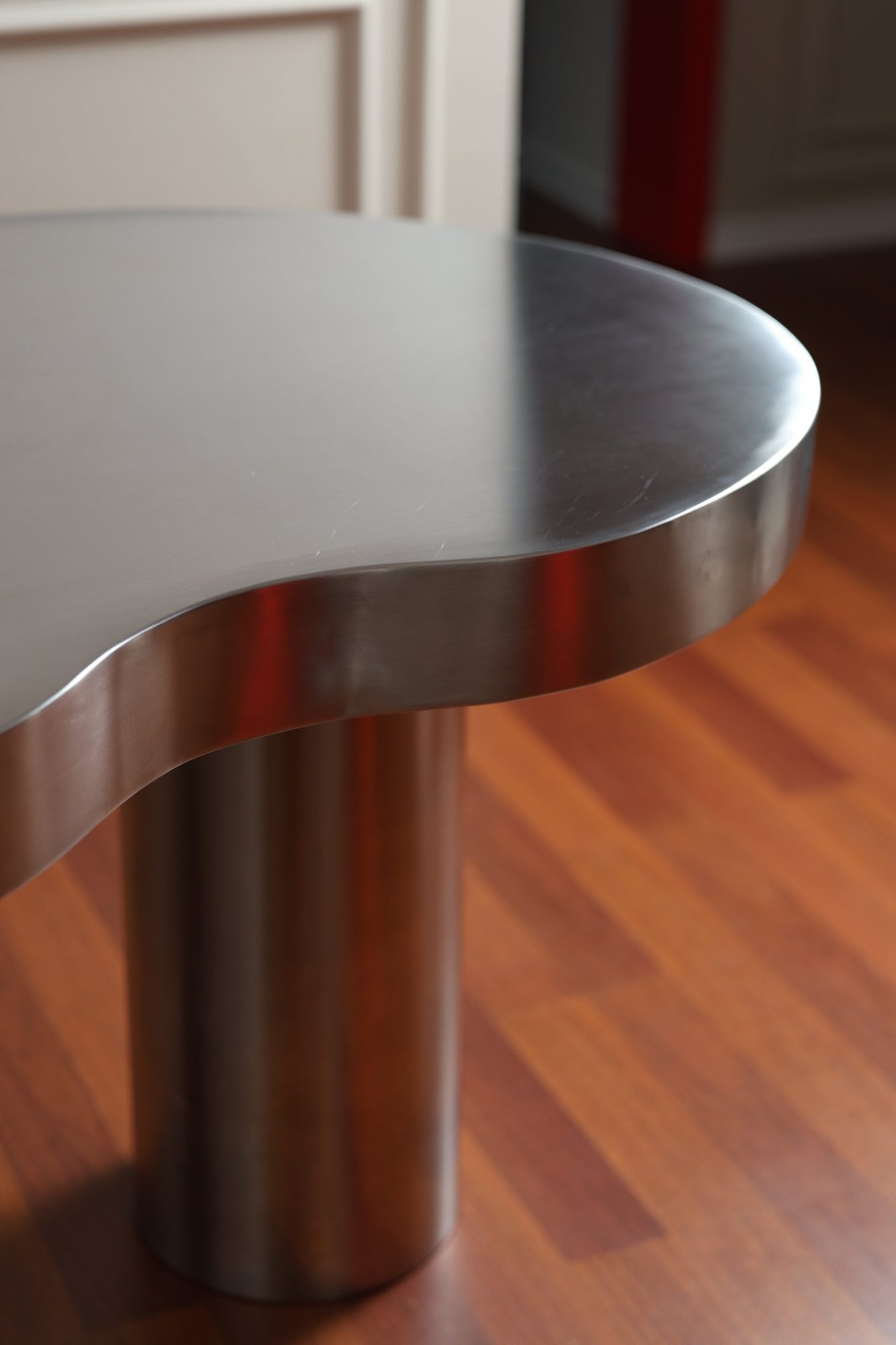 Rolled edge and cylindrical leg of the stainless steel table, Door 903, Tirana