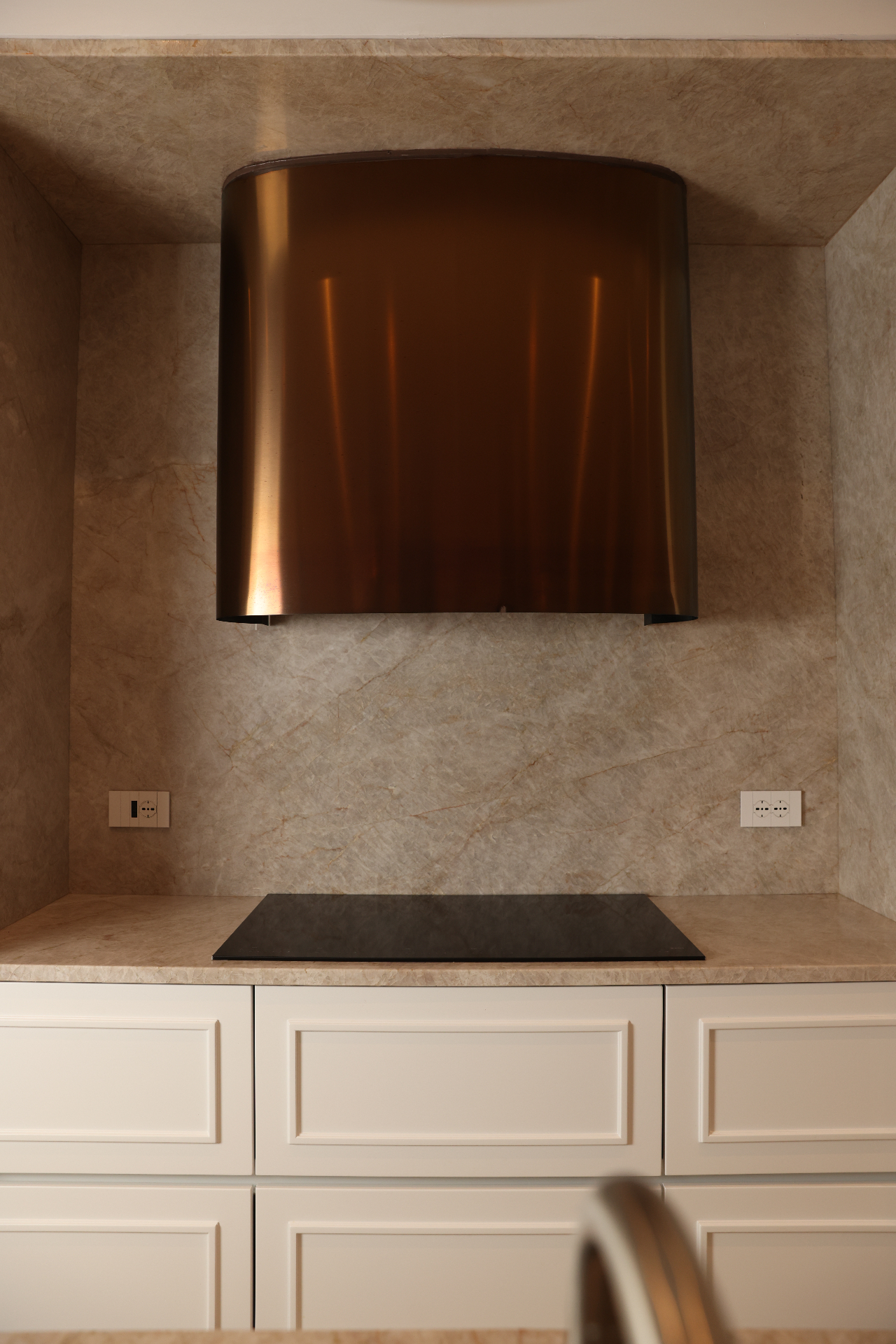 Front view of the sculptural kitchen hood at Villa Allegra
